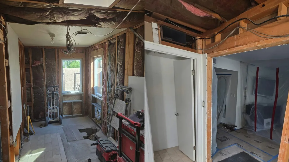 Room stripped back to wall studs and exposed plumbing after a water loss
